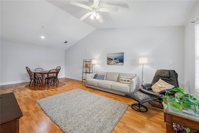 The living room has vaulted ceilings which are exc
