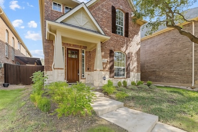 View of exterior entry featuring brick siding