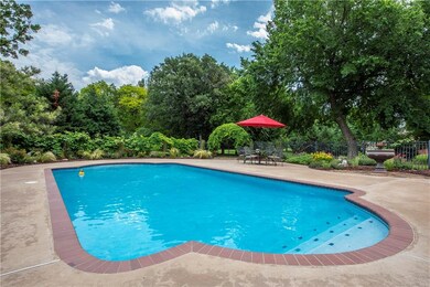Sport Court pool has custom cover and built in spa