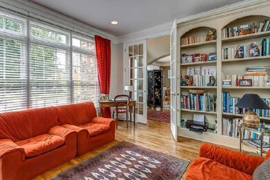 The study/library is the perfect place to hide away and spend some quiet time...beautiful built-ins, French doors, lots of light!