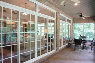 Fantastic screened porch over looks the 1.8 acre, 