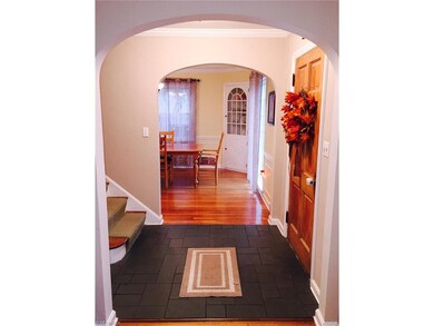 Front foyer with dining room to the right and livi