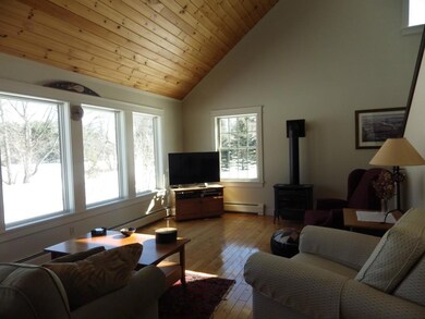 Living room with wood floors,...