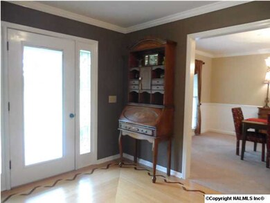 Nice, wide foyer awashed in natural sunlight.