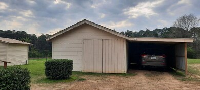 View of outdoor structure featuring a carport and 