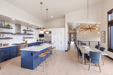 Kitchen featuring light wood-type flooring, tastef