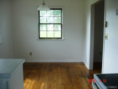 Dining Area off kitchen with new paint & hardwood 