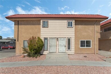 View of front facade featuring stucco siding and a