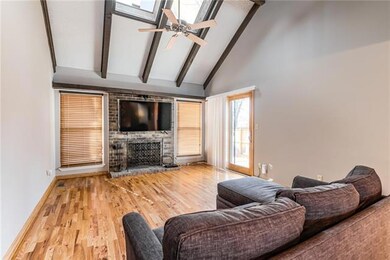 Cozy great room with vaulted ceiling and skylights