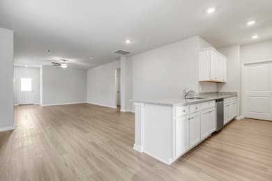 The open concept in the living room offers plenty