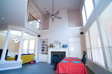 Dining space featuring a ceiling fan, ornate colu