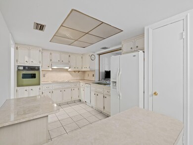 Kitchen sits off of the dining area and Florida ro