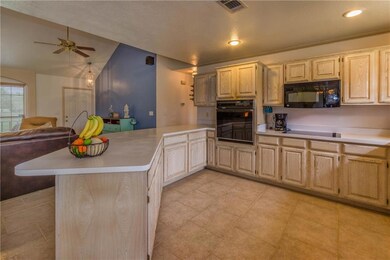 This bright spacious kitchen has a window that giv