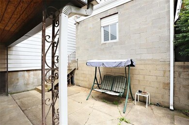 Back patio is partially covered. Stairs lead up to