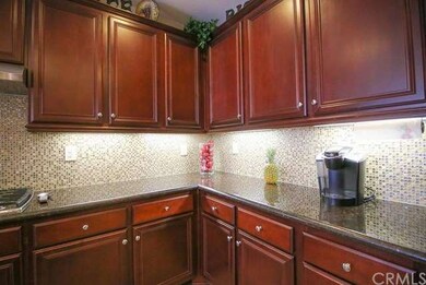 FULL BACKSPLASH AND UPGRADED CABINETS