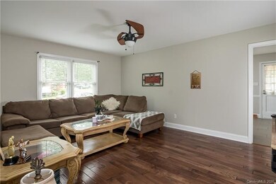 Family room with beautiful hard wood floors and st