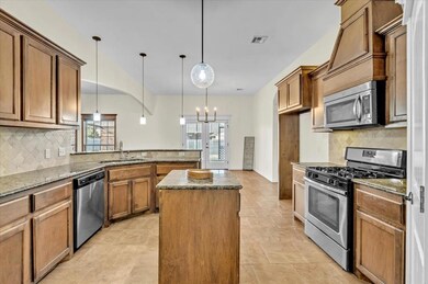 Kitchen with sink, appliances with stainless steel
