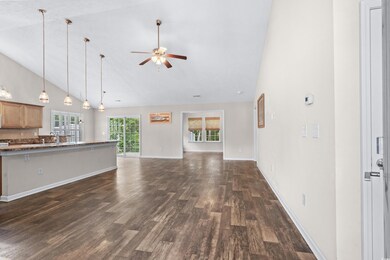 Unfurnished living room with sink, ceiling fan, hi