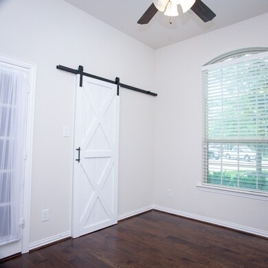 Office or fourth bedroom with sliding barn door.