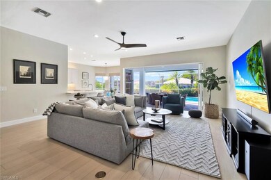 Open to the kitchen and casual eating areas with c