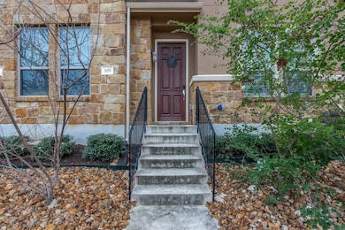 Property entrance with stone siding