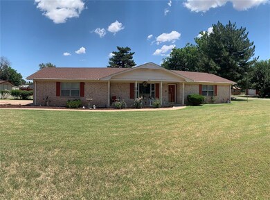 Ranch-style home with a front yard