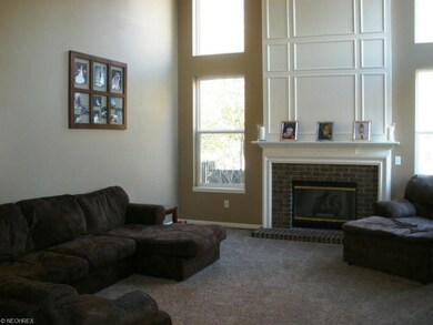 The soaring two story great room features huge win