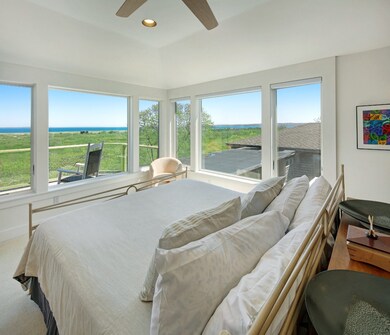 The primary suite enjoys commanding views from every angle