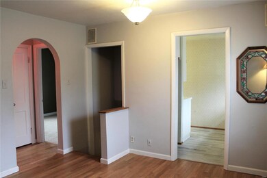 Entry to kitchen, basement and hallway from living room