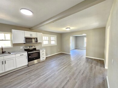 Kitchen featuring sink, light hardwood / wood-styl