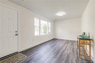 Entryway featuring dark hardwood flooring