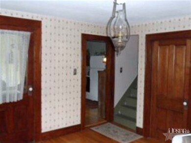 Looking toward kitchen and stairs to second floor