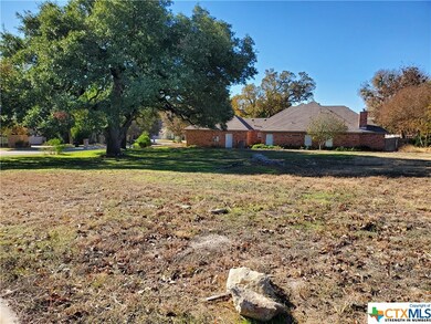 From Creekview Ln looking at the lot