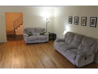 View of living room/entry from fireplace.