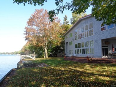 Rear of the home features floor to ceiling windows