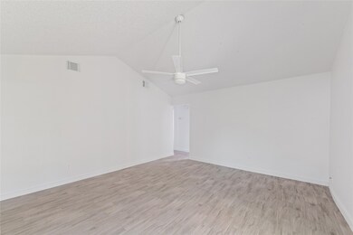 This room features a high ceiling with a modern ce