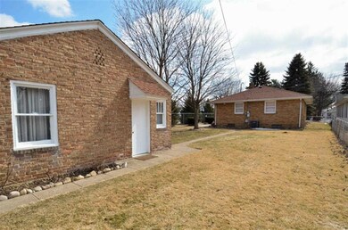 Nice side view out towards the brick garage, garag
