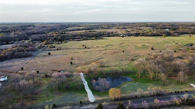 Birds eye view of property with a rural view and a