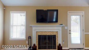 Wood Fireplace and Rear Exterior Door