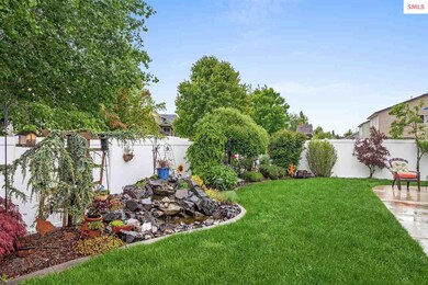 Backyard completely landscaped w/cement curbing, e