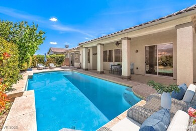 View of pool with a patio, a ceiling fan, and a fe