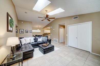 Spacious living area with tile floors