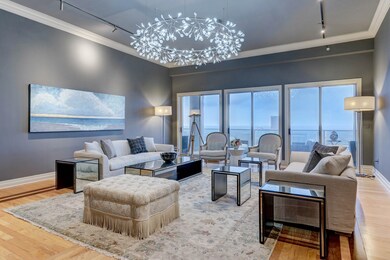The Formal Living Room boasts soaring ceilings, lu