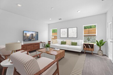 Living room with recessed lighting, visible vents