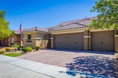 Spacious 3-car garage with beautiful paver drivewa