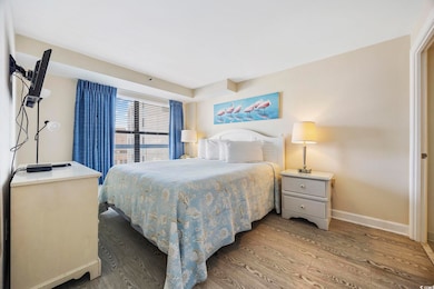 Bedroom with hardwood / wood-style flooring