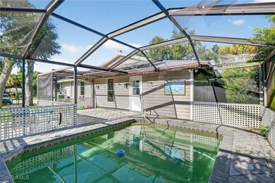 Swimming pool with a sunroom and a lanai