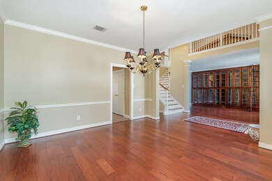 The formal dining room features gorgeous hardwood flooring, crown molding, chair molding with a classic chandelier!  Many special meals are sure to take place here!