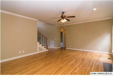 Large great room with hardwood flooring.
