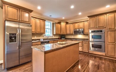 Gourmet Granite & Stainless Center Island Kitchen